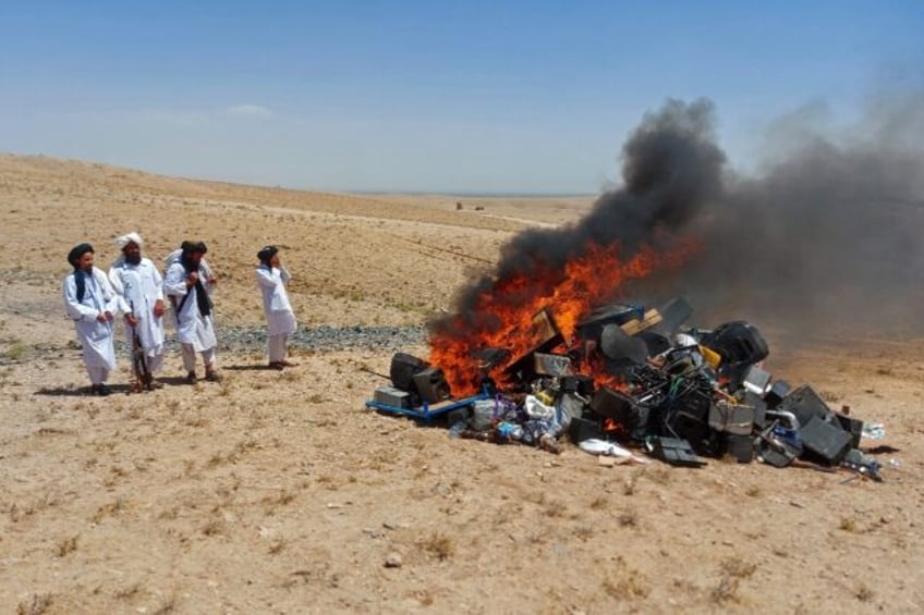 taliban create bonfire of immoral music equipment