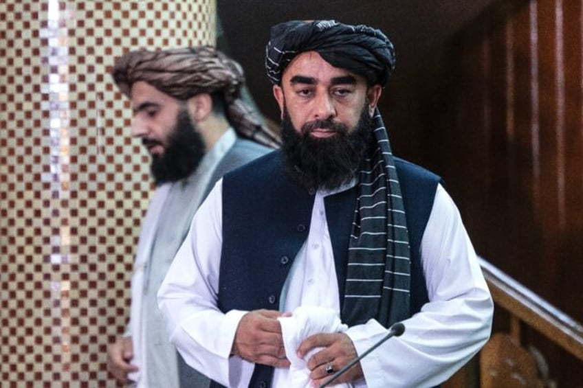 Taliban spokesman Zabihullah Mujahid arrives to attend a press conference in Kabul on July