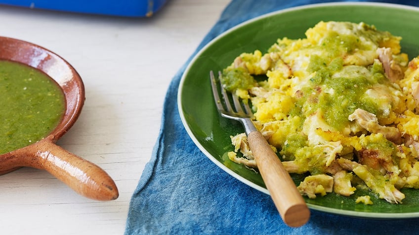 A tamal casserole plated on a green plate.