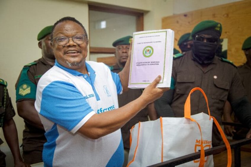 Tanzania's main opposition leader Tundu Lissu (C) was arrested in April in a move denounce