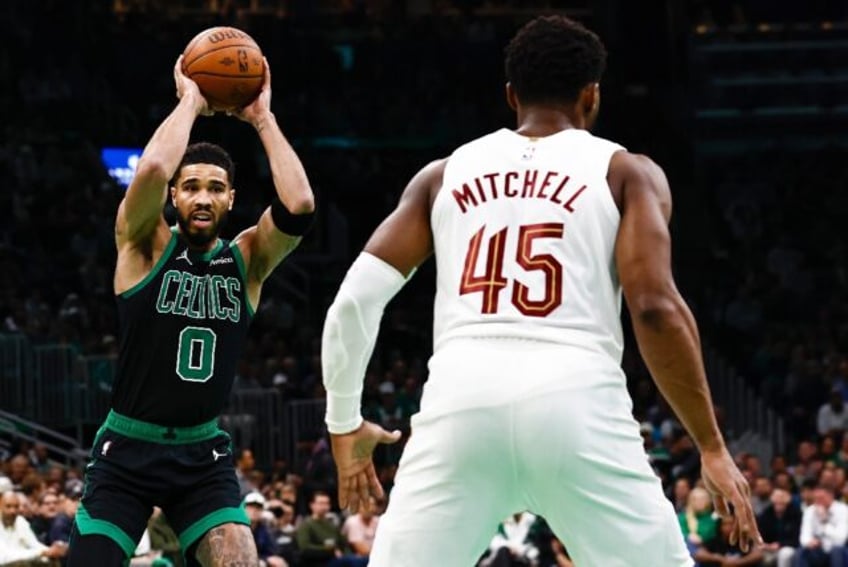 Jayson Tatum lines up a pass against Cleveland's Donovan Mitchell in the NBA Cup on Tuesda