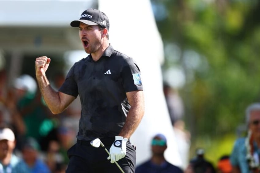 Canada's Nick Taylor reacts after chipping in for an eagle from 60 feet on the 18th green