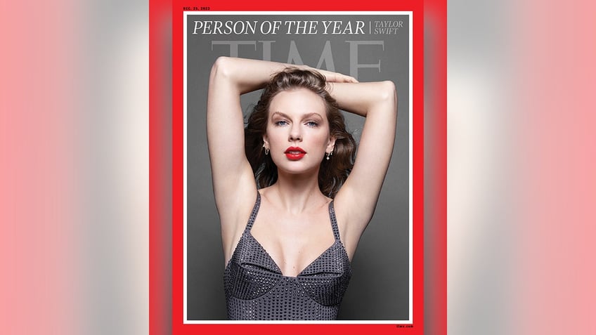 Taylor Swift has her arms over her head in dark grey sparkly dress for TIME cover