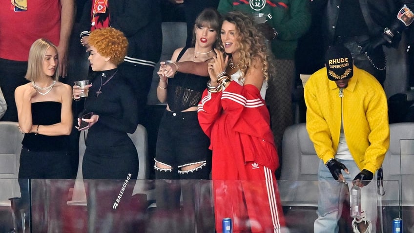 Ashley Avignone, from left, Ice Spice, Taylor Swift and Blake Lively in the stands at Super Bowl LVIII