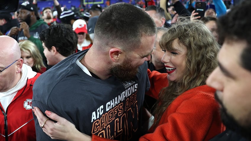 Travis Kelce celebrates with Taylor Swift