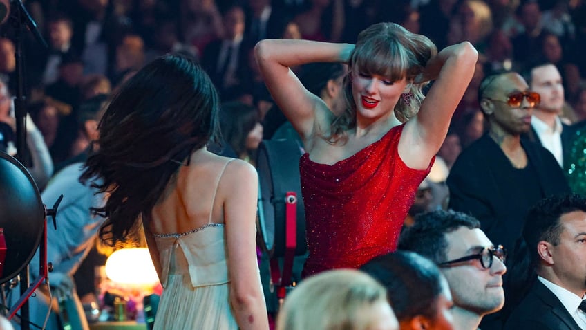 Taylor Swift and Margaret Qualley dance at the Grammys