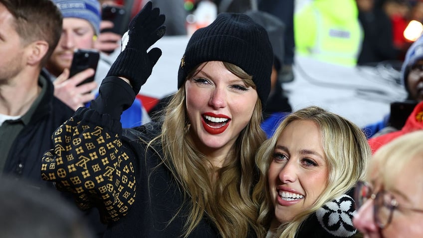 Taylor Swift and Brittany Mahomes smile