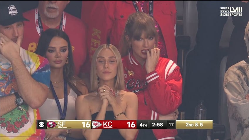 Taylor Swift biting her nails in the stands at Super Bowl LVIII