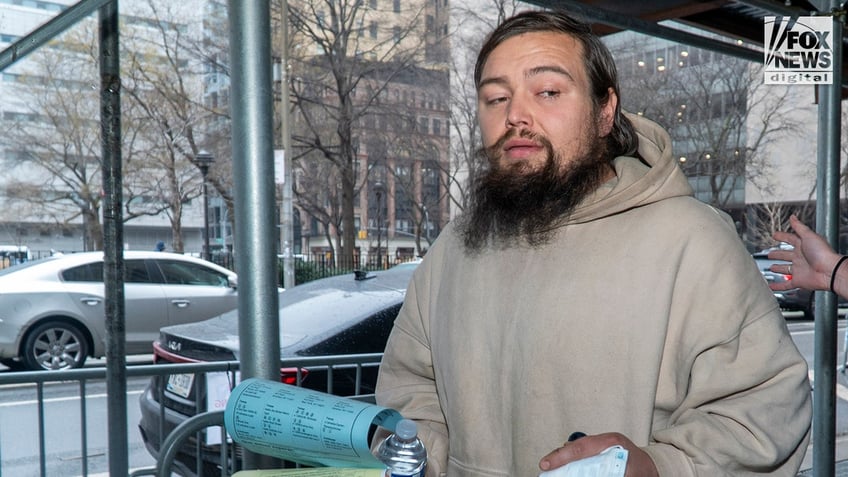 David Crowe departs the Manhattan Criminal Court following his court appearance