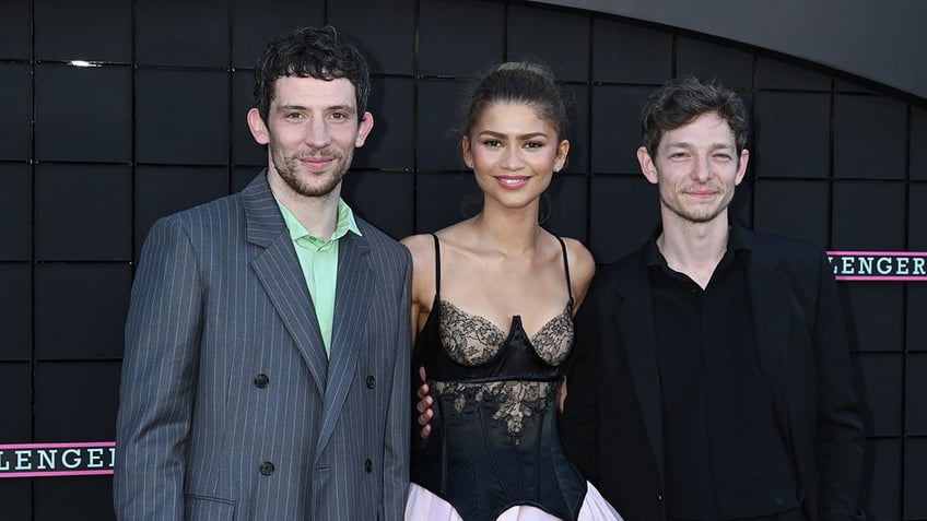 Josh O'Connor, Zendaya, and Mike Faist posing together