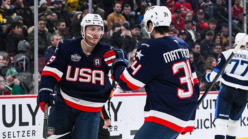 Matthew Tkachuk celebrates with Auston Matthews