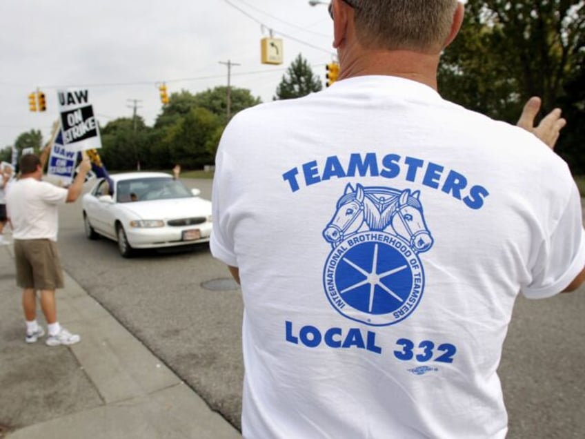 FLINT - SEPTEMBER 25: Members of Teamsters Local 332 in Flint watch over the picket line a