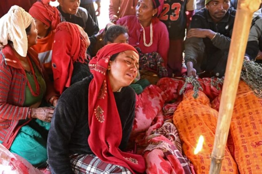 tears of a child as nepalis cremate quake dead