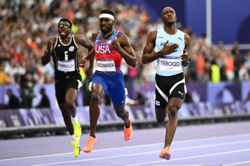 Letsile Tebogo crosses the line after winning the Olympic men's 200m with ease