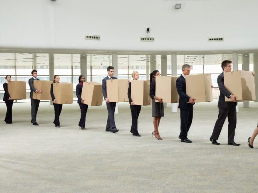 laid off workers carrying boxes