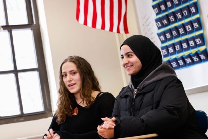 Rawda Elbatrawish (R) and Liora Pelavin speak during an interview at Teaneck High School i