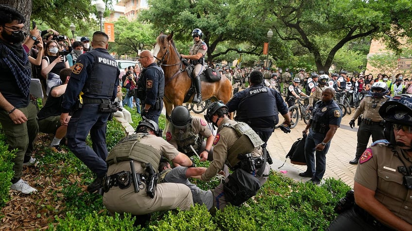 State troopers arrest a man at a pro-Palestinian protest