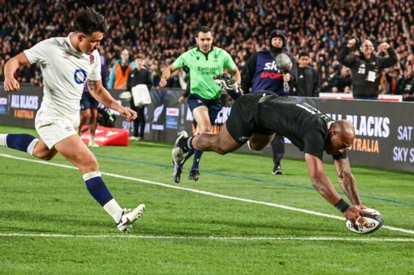 Mark Tele'a scores his second try against England in Auckland