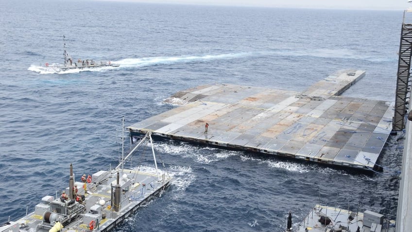 temporary floating pier for gaza aid completed will move into position once weather lets up pentagon