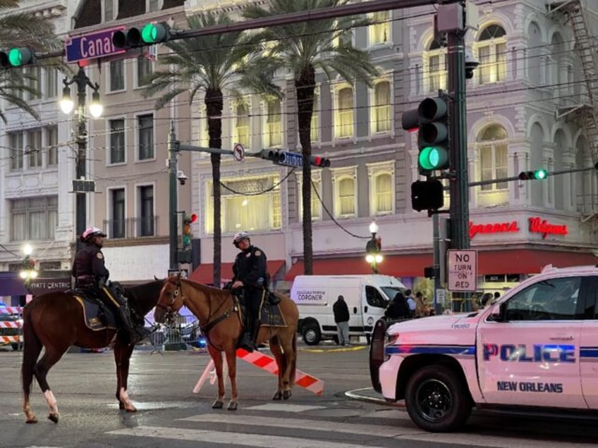 Police cordon off the intersection of Canal Street and Bourbon Street in the French Quarte