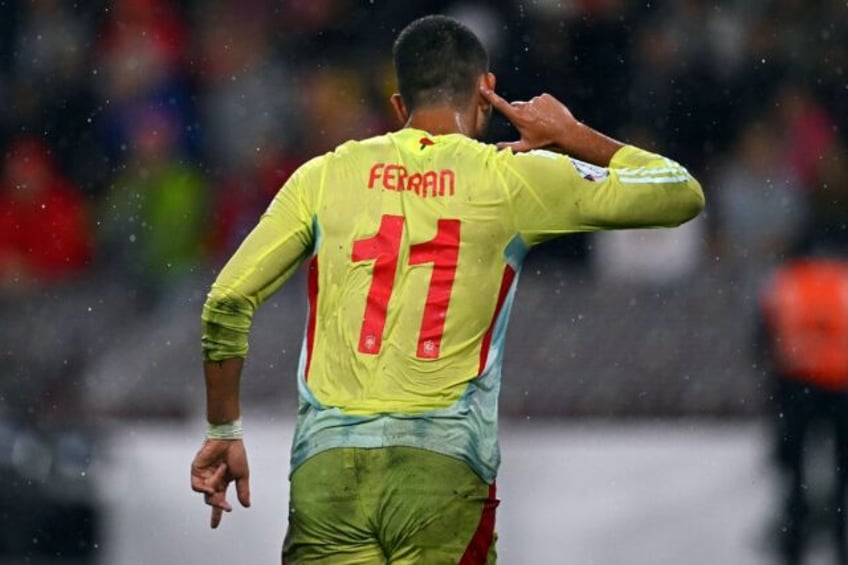 Spain's forward Ferran Torres celebrates after scoring Spain's fourth goal against Switzer