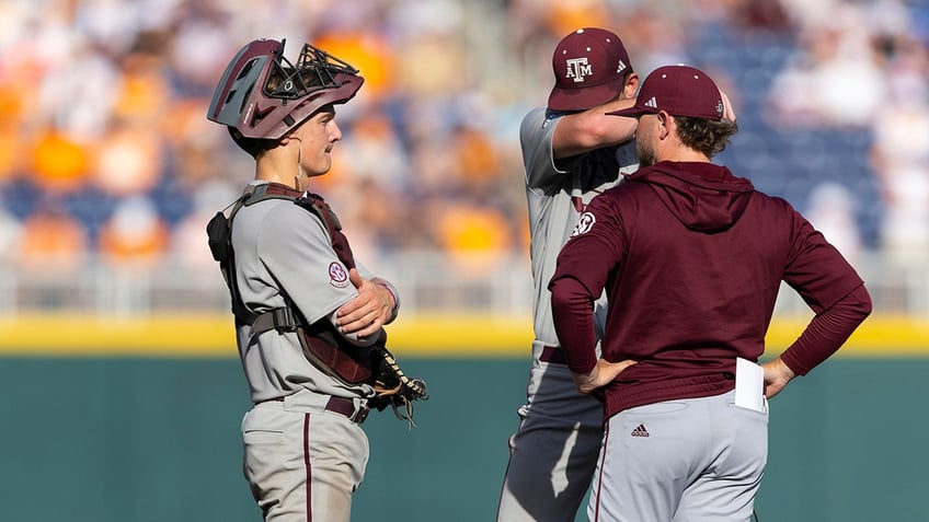 Texas A&M checks on the pitcher