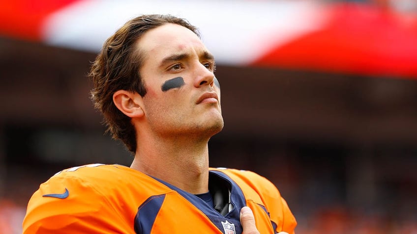 Brock Osweiler looks on before a game