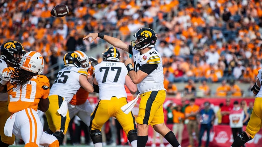 Iowa Hawkeyes quarterback throws the ball