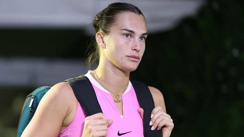 Aryna Sabalenka walks through the tunnel