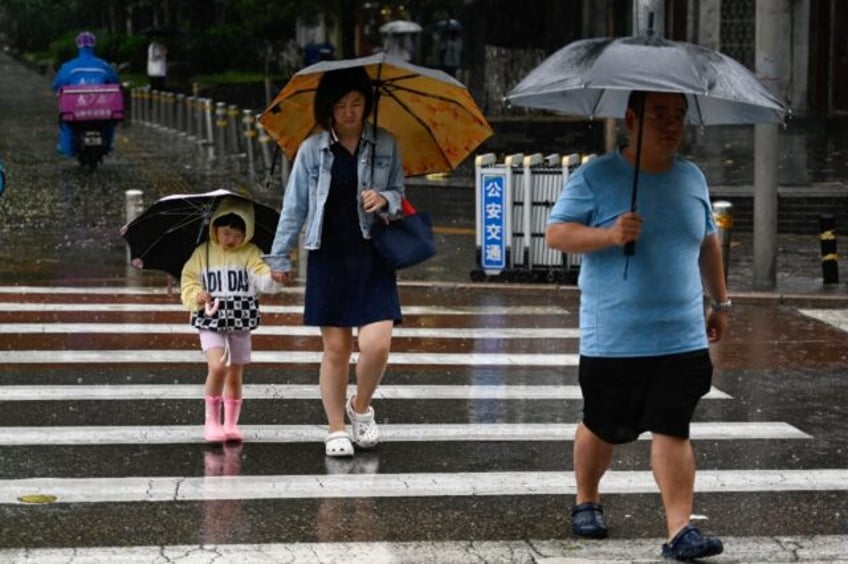 tens of thousands evacuated as northern china hit by torrential rain