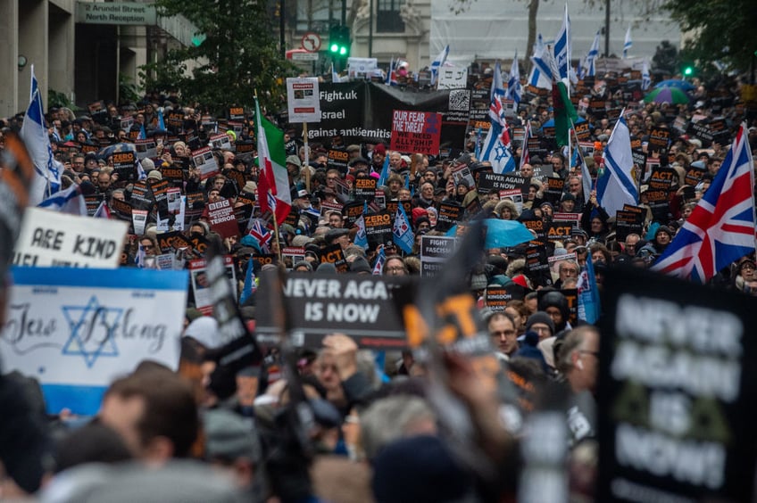 tens of thousands march against antisemitism in london including ex pm boris johnson