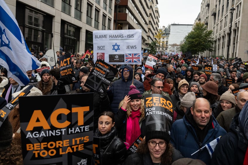 tens of thousands march against antisemitism in london including ex pm boris johnson