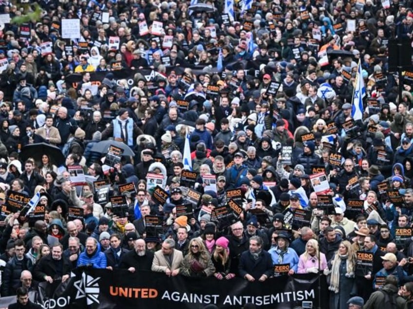 tens of thousands march against antisemitism in london including ex pm boris johnson