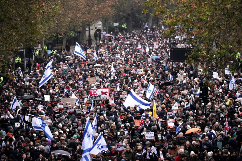 tens of thousands march against antisemitism in london including ex pm boris johnson