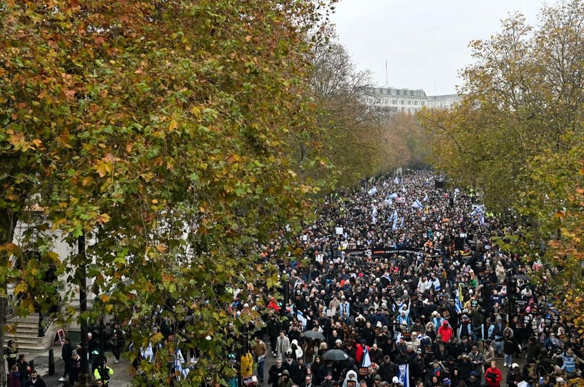 tens of thousands march against antisemitism in london including ex pm boris johnson