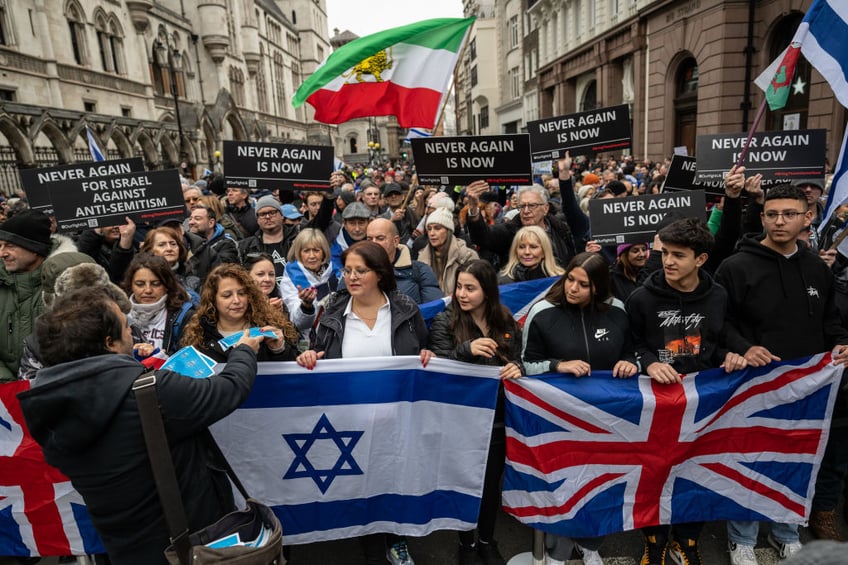 tens of thousands march against antisemitism in london including ex pm boris johnson