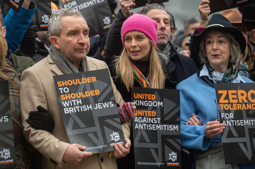 tens of thousands march against antisemitism in london including ex pm boris johnson