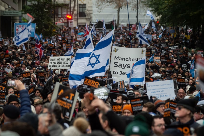 tens of thousands march against antisemitism in london including ex pm boris johnson