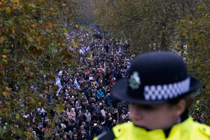 tens of thousands march against antisemitism in london including uk ex prime minister boris johnson