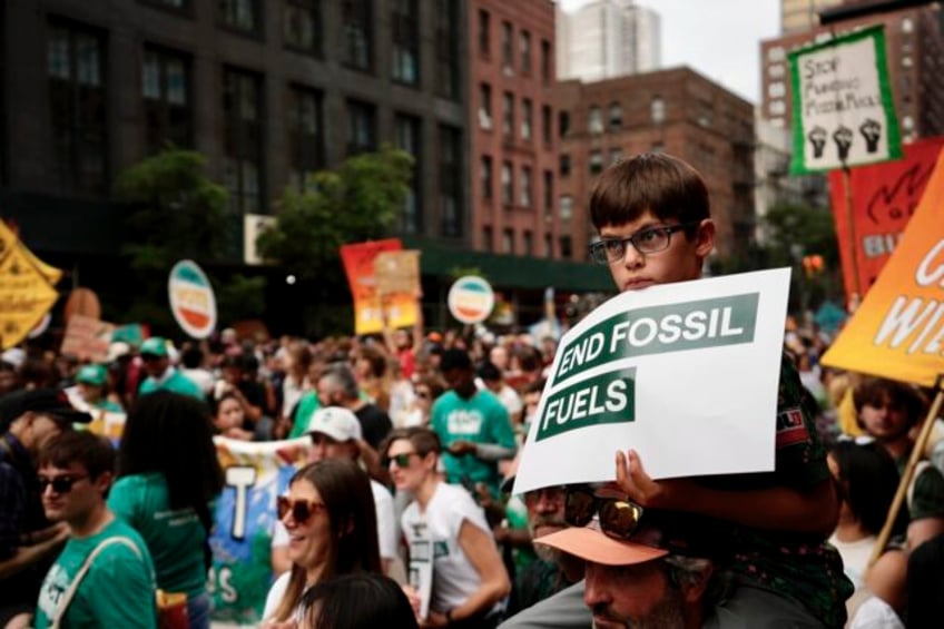 tens of thousands march to kick off climate summit demanding end to warming causing fossil fuels