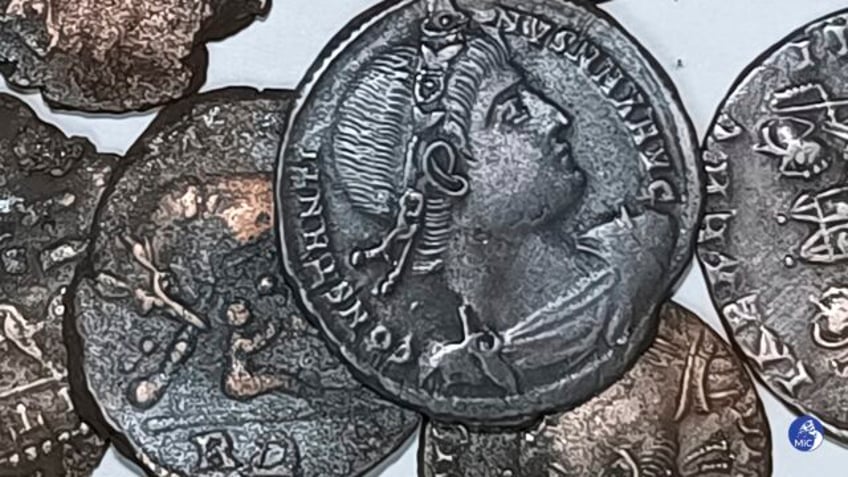 tens of thousands of ancient coins have been found off sardinia they may be spoils of a shipwreck