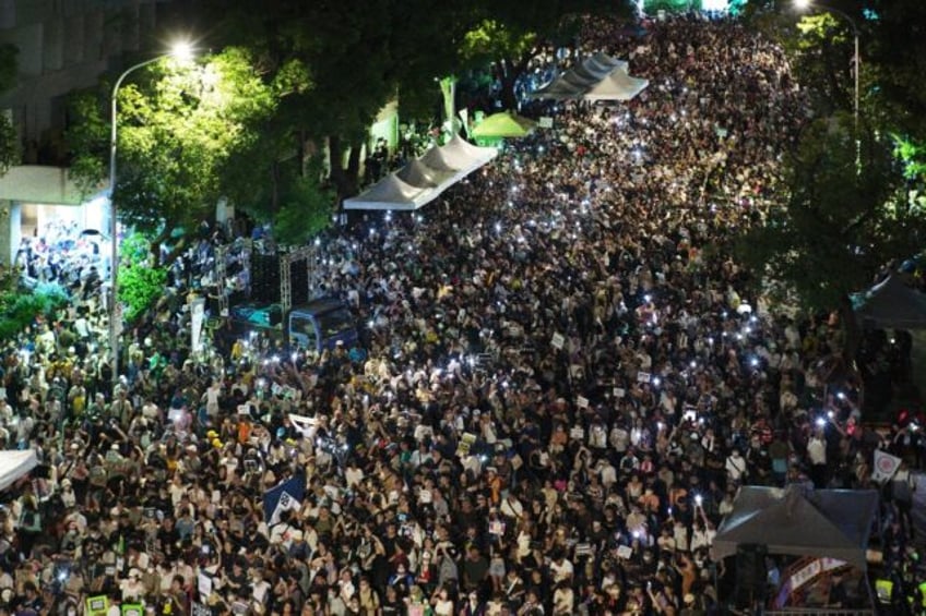 Tens of thousands gather outside parliament in Taipei to protest controversial bills propo