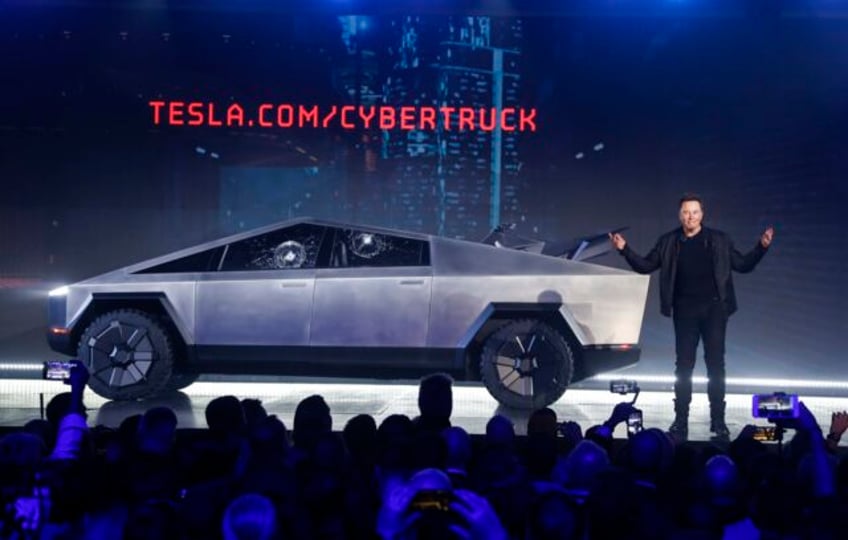 tesla delivers about a dozen stainless steel cybertruck pickups as it tries to fix production woes