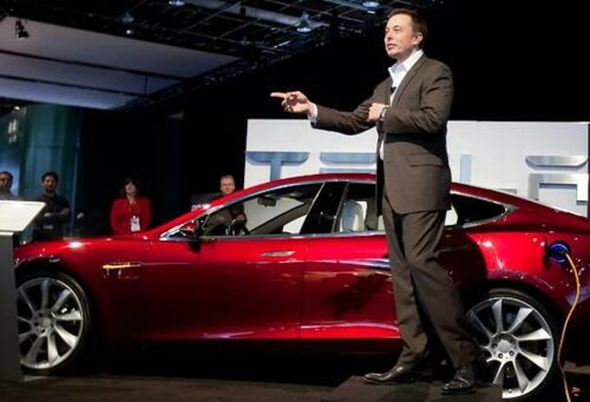 tesla shares tumble after company tells all us workers they are getting a pay raise