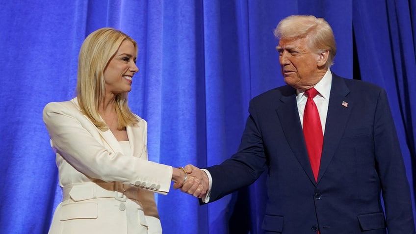 Attorney General Pam Bondi shakes hands with President Donald Trump