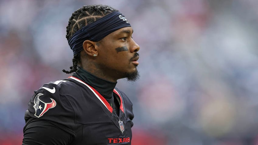 Stefon Diggs looks on before a game