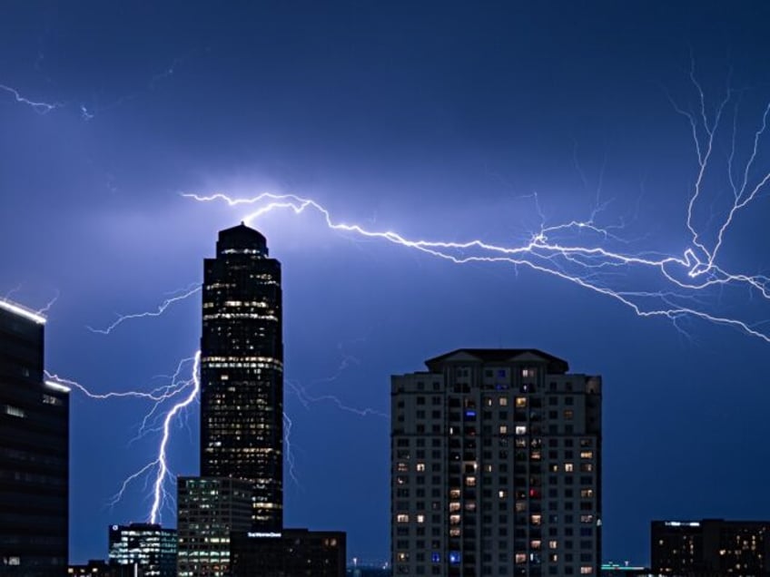 Lightning strikes the sky above the city of Houston, Texas, the United States, June 21, 20