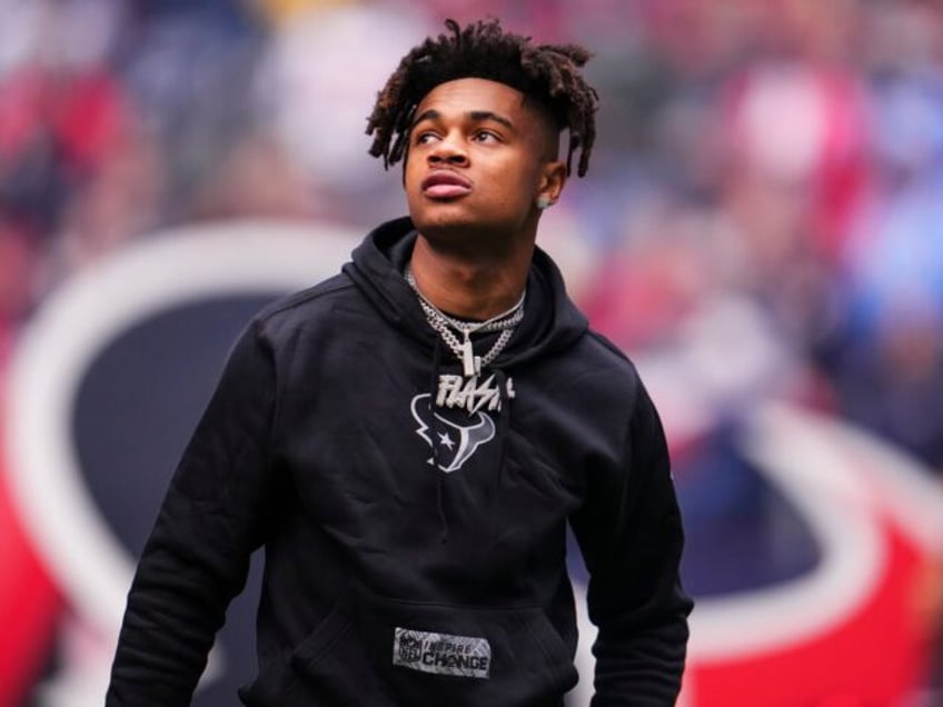 HOUSTON, TX - DECEMBER 31: Tank Dell #3 of the Houston Texans looks on from the field prio