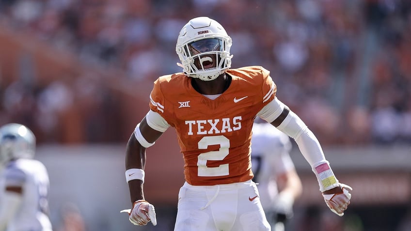 texas avoids upset with overtime win over kansas state