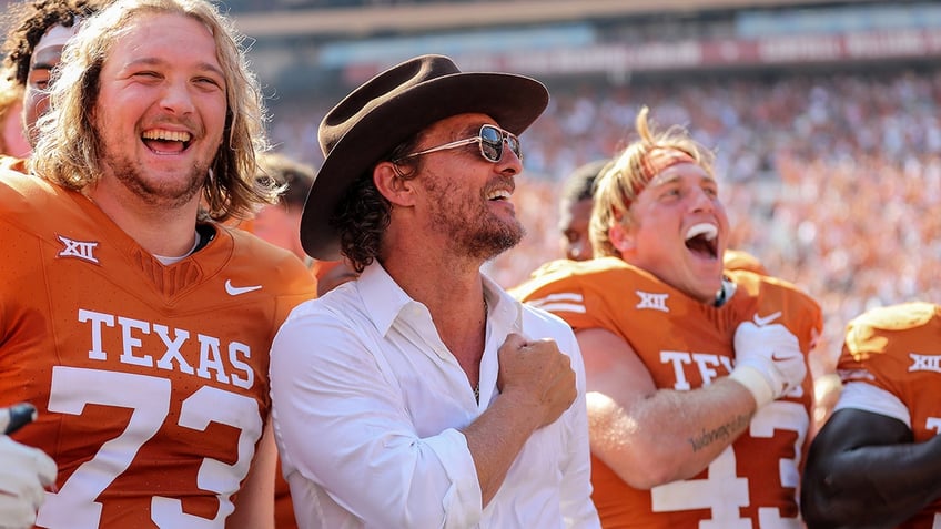 texas avoids upset with overtime win over kansas state